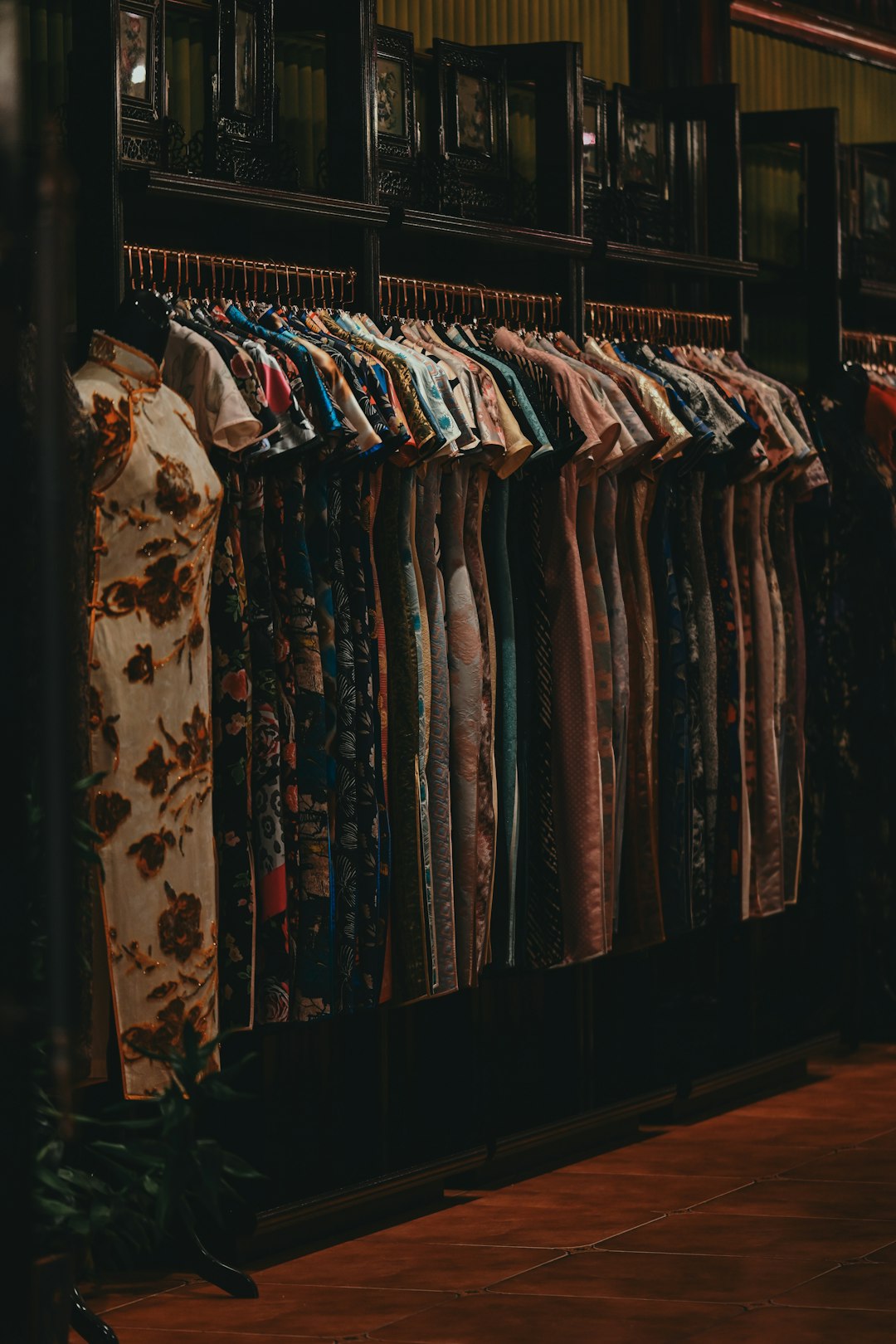 a-display-of-colorful-traditional-chinese-dresses-on-hangers-fmyv-awjsb4